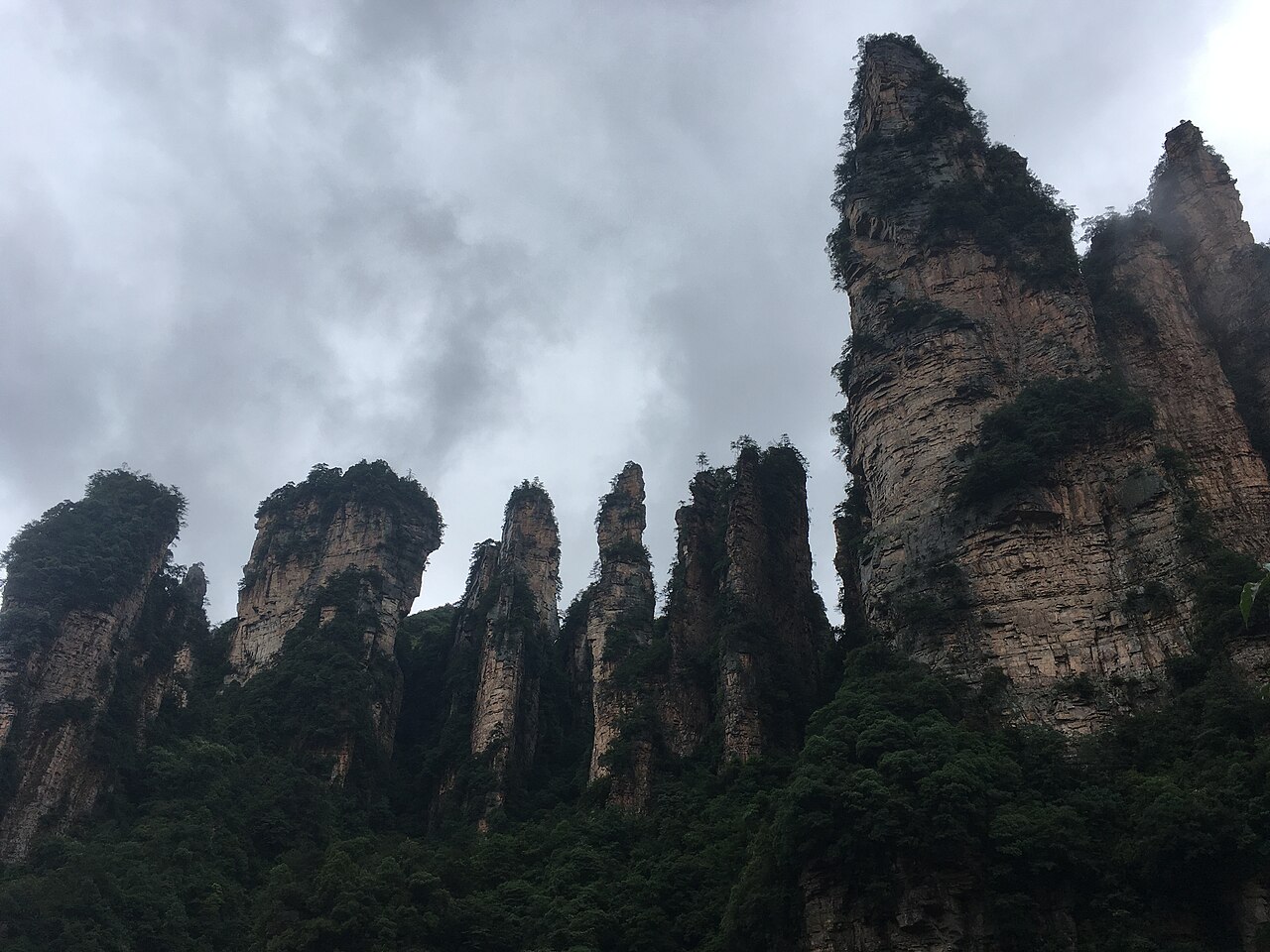 A misty viewpoint across Zhangjiajie's sandstone peaks.